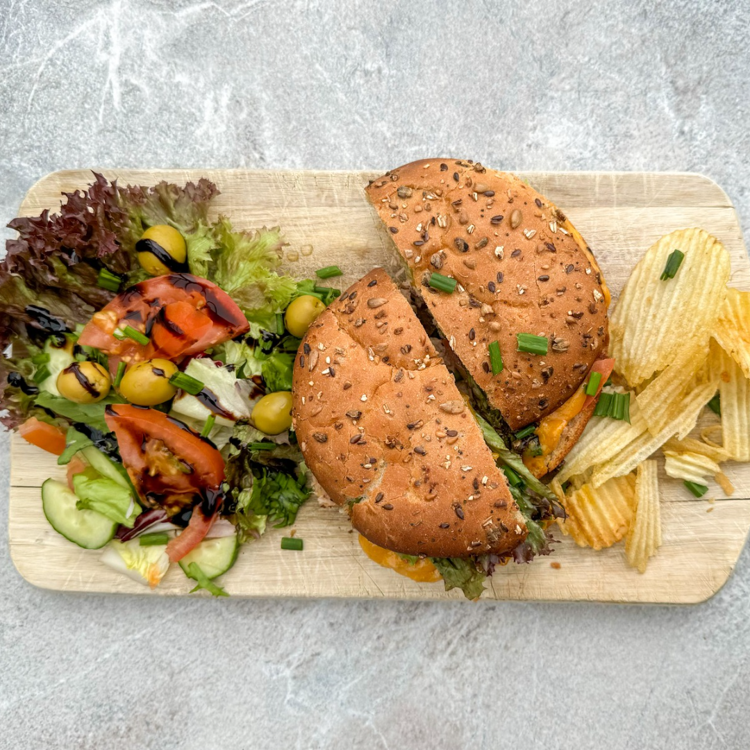 Tuna Melt Sandwich with side salad and crisps